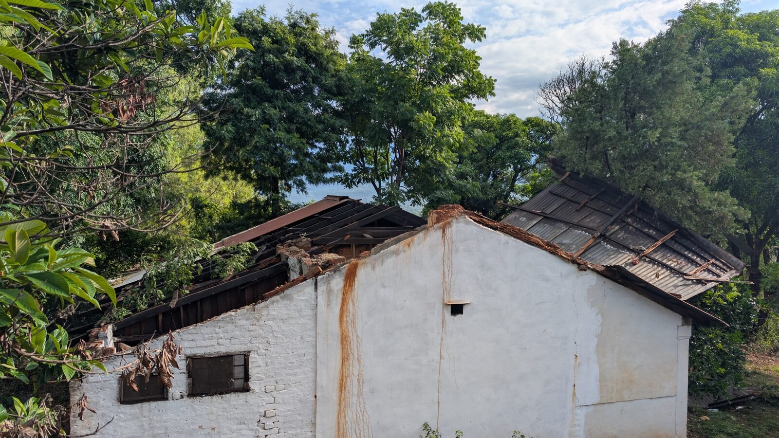 Documenting structural failure modes in traditional Himalayan masonry construction — north view of a damaged building, Kangra District